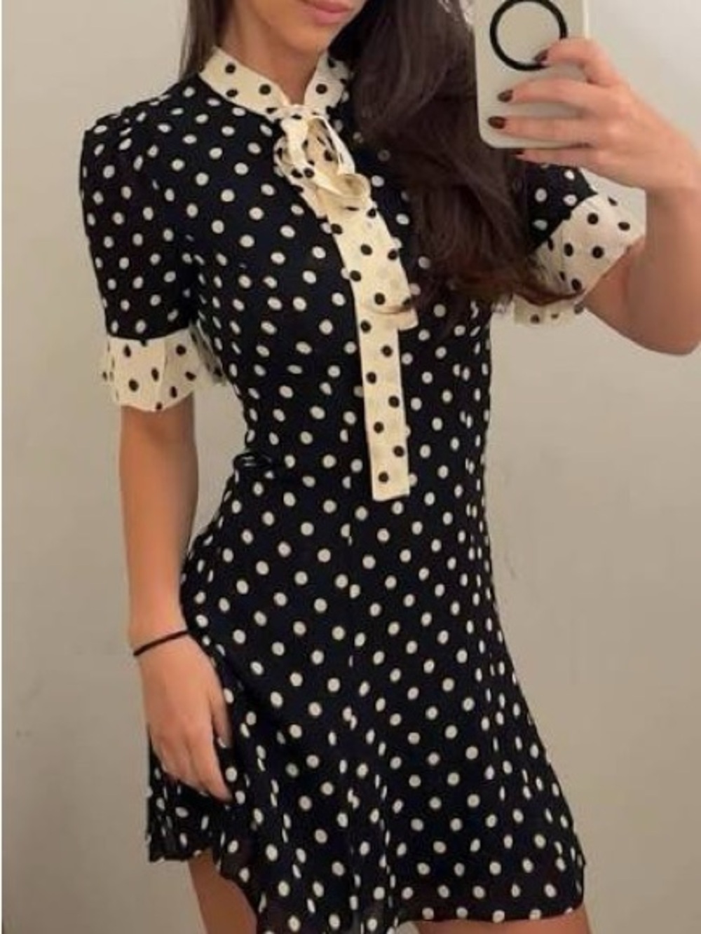 Reformation Nara Smith Polka Dot Tie-Neck Short Dress in Black and Cream